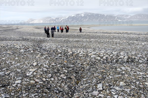 Hikers in the Arctic eis desert