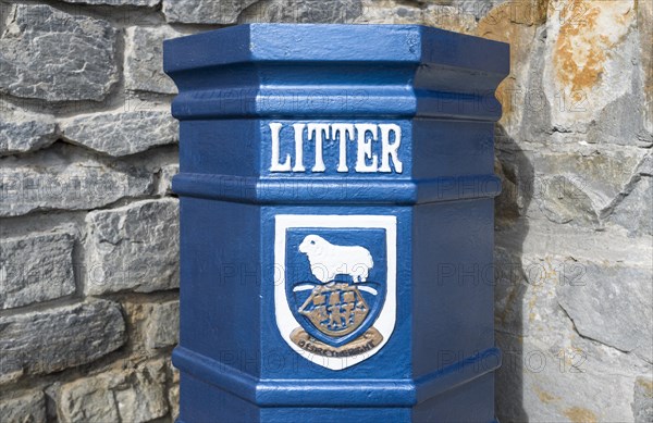 Bin with the coat of arms of the Falkland Islands and the motto 'Desire the Right'