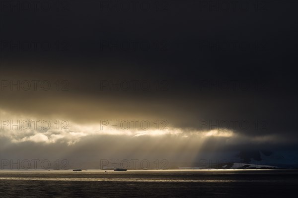 Sunlight shining through a hole in the clouds