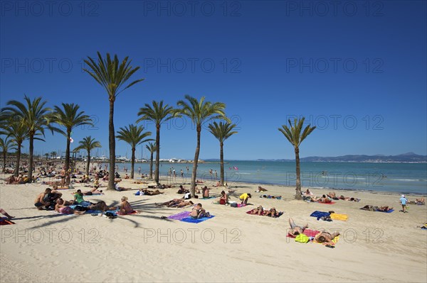 Tourists on Playa de s'Arenal beach