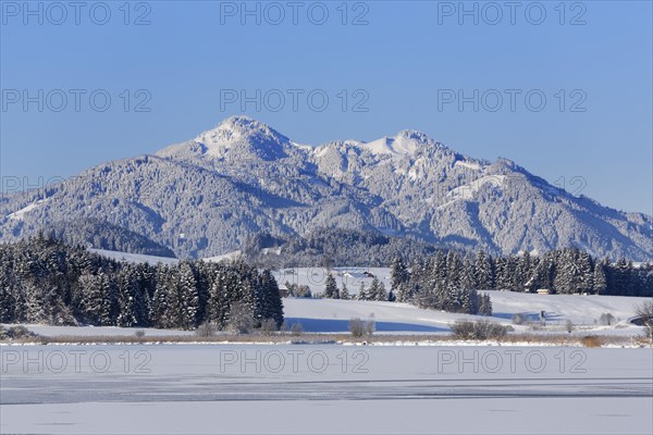 Frozen Hopfensee Lake with Mount Edelsberg and Mount Alpspitz
