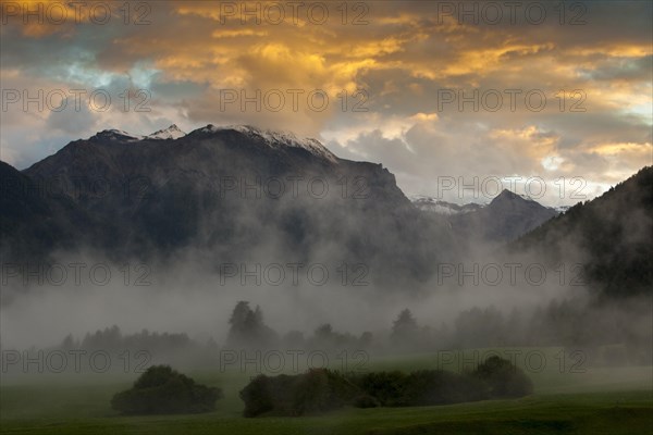 Evening mood with ascending mist in autumn