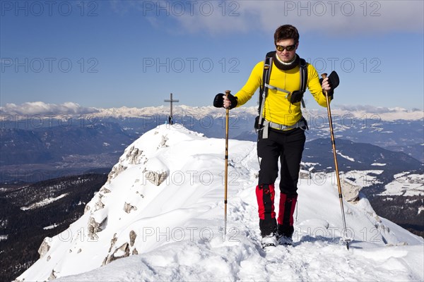 Winter hiker on the summit ridge of Jochgrimm