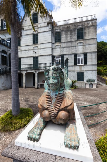 Sphinx sculpture in front of the palace