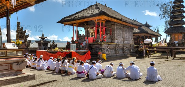 Hindu worshippers praying at Pura Ulun Danu Batur Temple