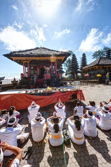 Hindu worshippers praying at Pura Ulun Danu Batur Temple