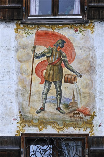 Lueftlmalerei mural of St. Florian from 1936 on the facade of a farmhouse