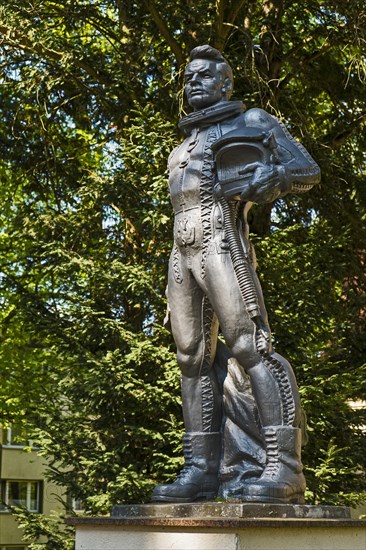 Sculpture of a pilot in front of the villa of a former commander