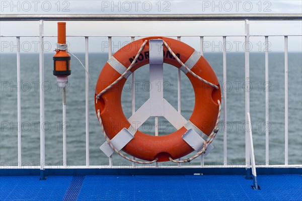 Lifebuoy on the railing on the Norrona ferry