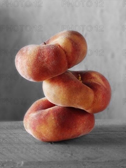 Donut peaches piled on top of each other