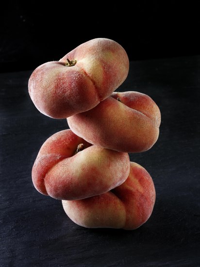 Donut peaches piled on top of each other