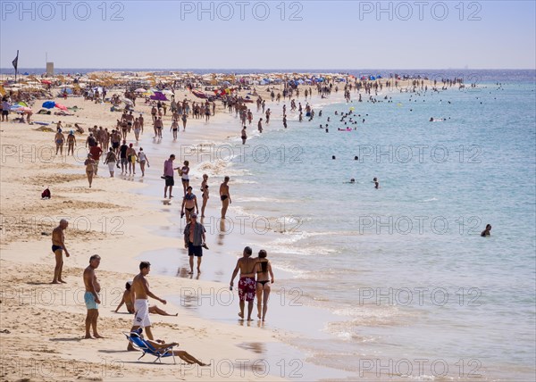Tourists on the beach of Playa del Matorral
