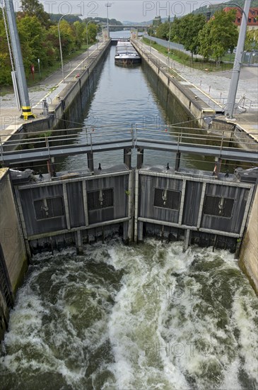 Cargo ship being lowered into a sluice