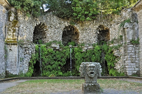Stone mask with four heads at the grotto of the water source
