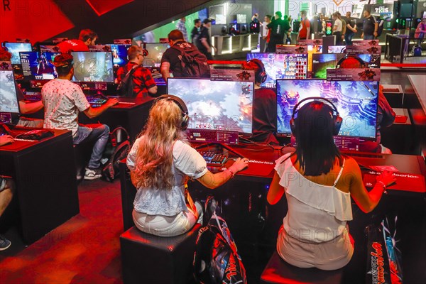 Young visitors at the pagan-online computer game in front of screens