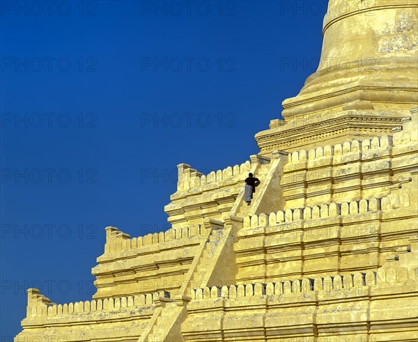Man on the stairs of Shwesandaw Pagoda