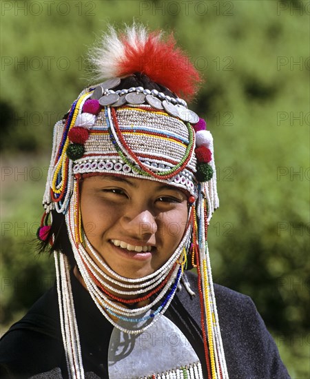 Akha girl with traditional clothing and headdress