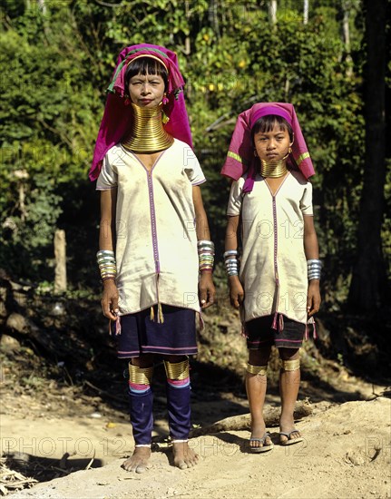 Long-necked woman and a girl of the Padaung mountain tribe