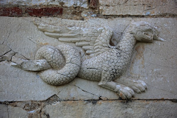 Venetian stone relief on the outer wall of St. Nicholas Church