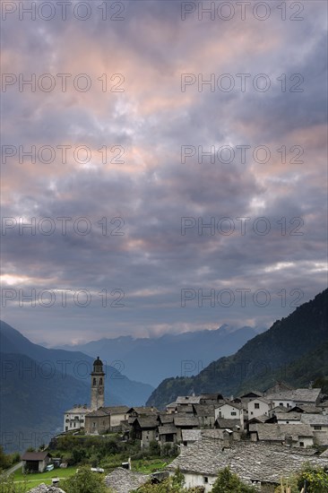Village with old stone houses at sunset