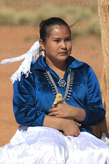 Navajo Indian woman holding a duckling