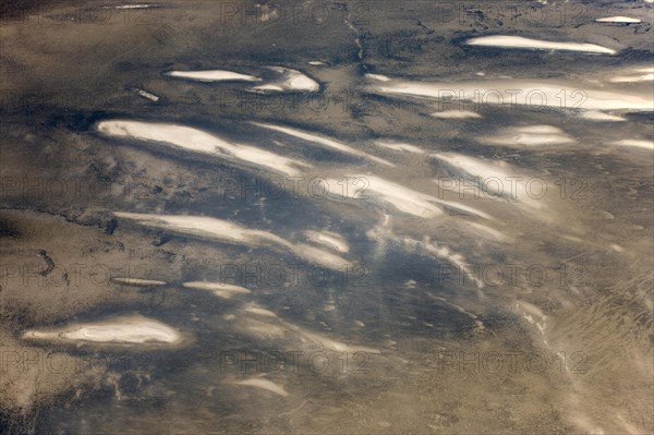 Low coastal dunes and barren desert land in the Namib Desert