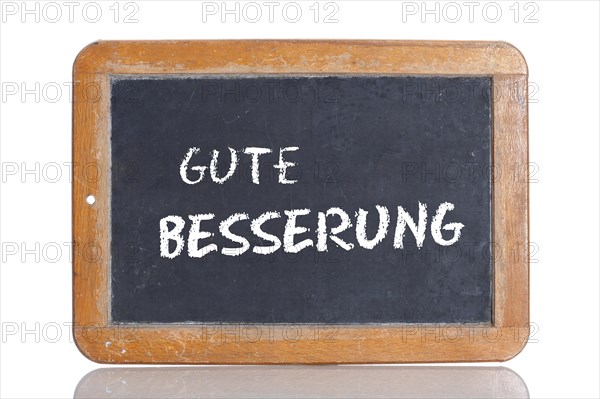 Old school blackboard with the words GUTE BESSERUNG