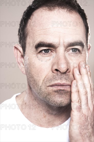 Man with markings for plastic surgery under his eye