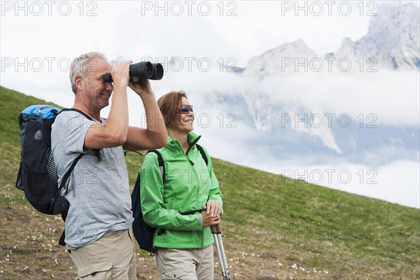 Couple enjoying the misty view while hiking