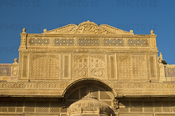 Richly decorated sandstone facade of an old Haveli or private mansion