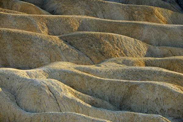 View from Zabriskie Point over eroded rock formations discoloured by minerals
