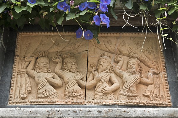 Relief plate with Asian dancers