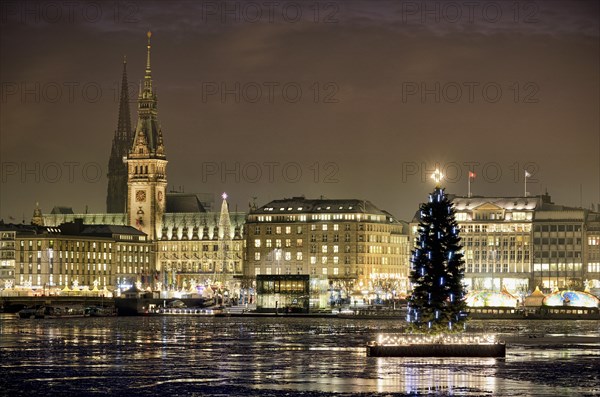 Binnenalster or Inner Alster Lake with a Christmas tree and City Hall