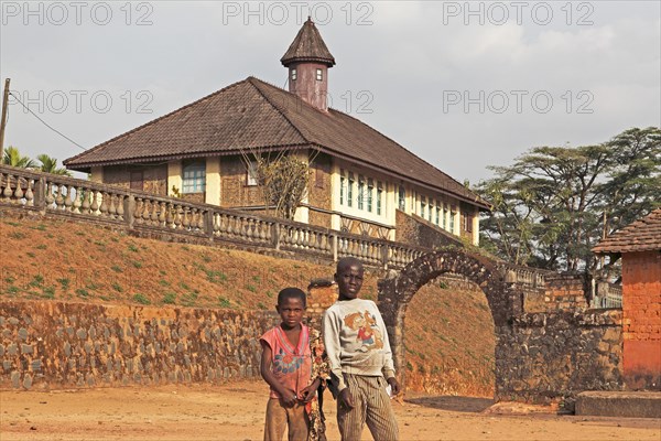 Children standing in front of the Palace Museum