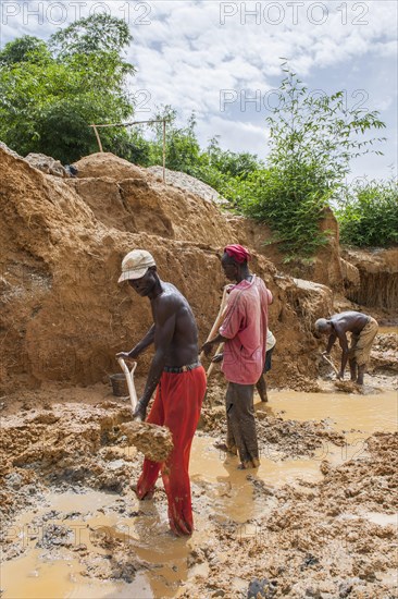 Workers digging at a diamond mine in the jungle