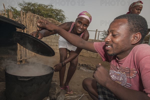 Members of the Rabelados religious community preparing a meal