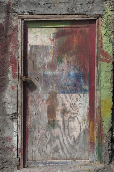 Paint-smeared door of a fisherman's hut