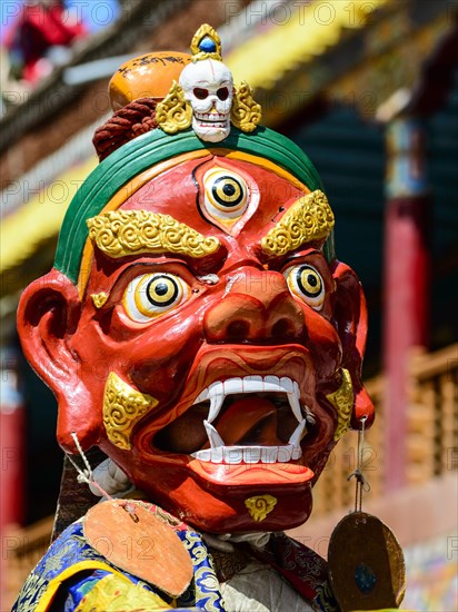 Monk performing ritual mask dance