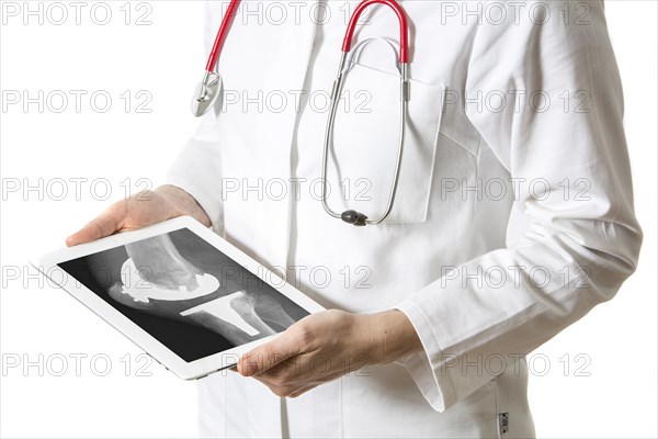Female doctor holding a tablet computer