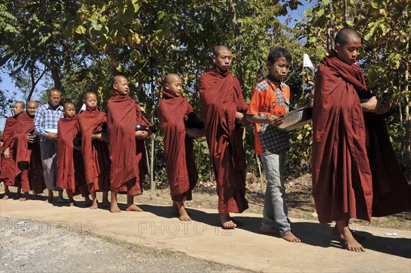 Buddhist monks collecting alms