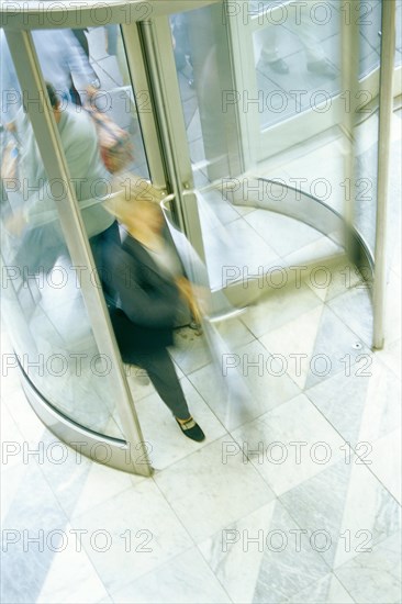 Revolving door with people