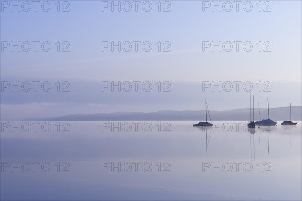Lake Starnberg with sailing boats in the morning