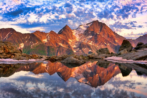Reflection of the Oberalpstock in a mountain lake