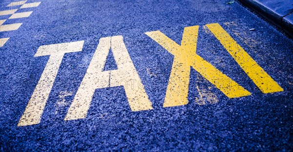 Taxi marking on a traffic lane.