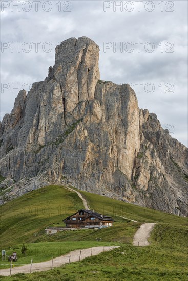 Mountain hut and mount Gusela on a cloudy day