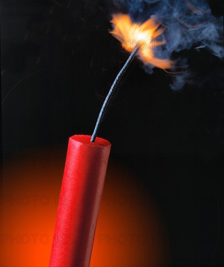 Stick of dynamite with the fuse burning