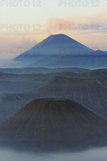 Sunrise over the smoking Gunung Bromo volcano