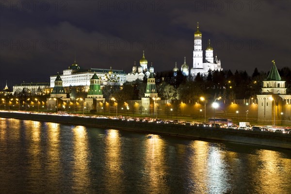 Moscow Kremlin with palace and cathedrals on Moskva River at night