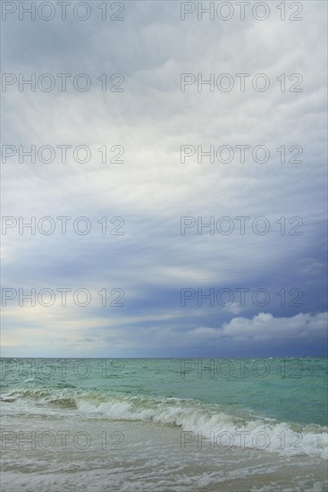 Storm clouds over the choppy sea