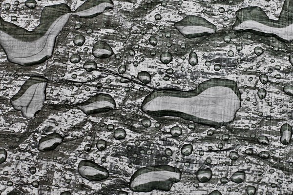 Water drops on tarpaulin